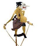 In Javanese wayang (shadow puppets), the panakawan or panakavan (phanakavhan) are the clown servants of the hero. There are four of them – Semar (also known as Ki Lurah Semar), Petruk, Gareng and Bagong. Semar is the personification of a deity, sometimes said to the be the dhanyang or guardian spirit of the island of Java. In Javanese mythology, deities can only manifest themselves as ugly or otherwise unprepossessing humans, and so Semar is always portrayed as short and fat with a pug nose and a dangling hernia.<br/><br/>His three companions are his adopted sons, given to Semar as votaries by their parents. Petruk is portrayed as tall and gangling with a long nose, Gareng as short with a club foot and Bagong as obese.<br/><br/>Wayang is a Javanese word for particular kinds of theatre (literally 'shadow'). When the term is used to refer to kinds of puppet theatre, sometimes the puppet itself is referred to as wayang. Performances of shadow puppet theatre are accompanied by gamelan in Java.<br/><br/>UNESCO designated Wayang Kulit, a shadow puppet theatre and the best known of the Indonesian wayang, as a Masterpiece of Oral and Intangible Heritage of Humanity on 7 November 2003.